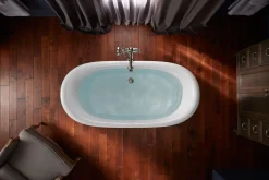 Bath base for freestanding bath