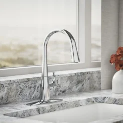 Compact pull-down kitchen sink faucet with three-function sprayhead