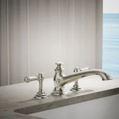 Deck-mount bath spout with flare design