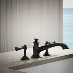 Deck-mount bath spout with flare design
