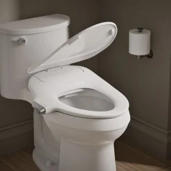 Elongated manual bidet toilet seat
