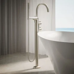 Floor-mount bath filler trim with lever handles and handshower