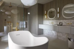Floor-mount bath filler trim with lever handles and handshower