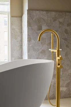 Floor-mount bath filler trim with lever handles and handshower