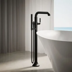 Floor-mount bath filler trim with handshower