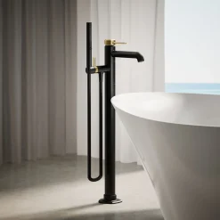 Floor-mount bath filler trim with handshower