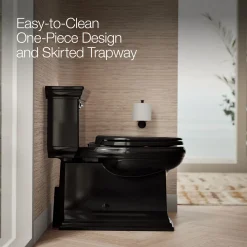 One-piece compact elongated toilet with skirted trapway, 1.28 gpf