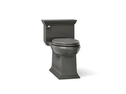 One-piece compact elongated toilet with skirted trapway, 1.28 gpf