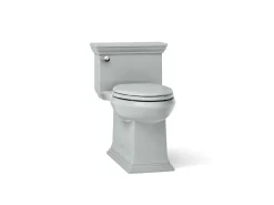 One-piece compact elongated toilet with skirted trapway, 1.28 gpf