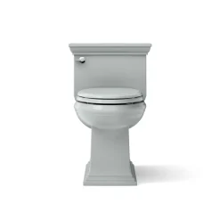 One-piece compact elongated toilet with skirted trapway, 1.28 gpf