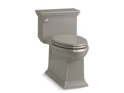 One-piece compact elongated toilet with skirted trapway, 1.28 gpf