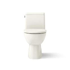 One-piece compact elongated toilet with skirted trapway, 1.28 gpf