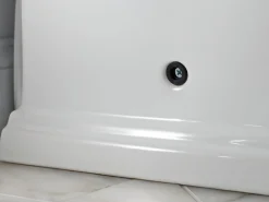 One-piece compact elongated toilet with skirted trapway, 1.28 gpf