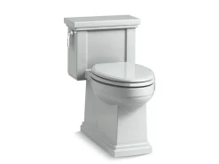 One-piece compact elongated toilet with skirted trapway, 1.28 gpf