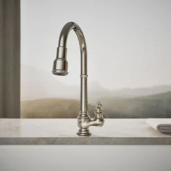 Pull-down kitchen sink faucet with three-function sprayhead
