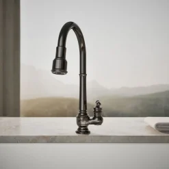 Pull-down kitchen sink faucet with three-function sprayhead