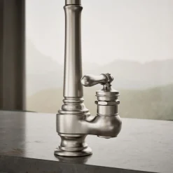 Pull-down kitchen sink faucet with three-function sprayhead