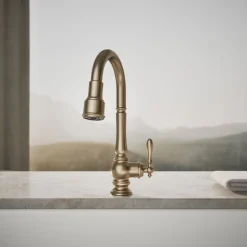 Pull-down kitchen sink faucet with three-function sprayhead