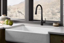 Pull-down kitchen sink faucet with three-function sprayhead