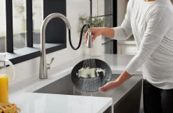 Pull-down kitchen sink faucet with three-function sprayhead