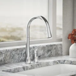 Pull-down kitchen sink faucet with three-function sprayhead