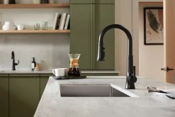 Pull-down kitchen sink faucet with three-function sprayhead