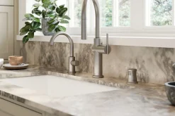 Pull-down kitchen sink faucet with three-function sprayhead