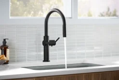 Pull-down kitchen sink faucet with three-function sprayhead
