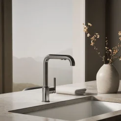 Pull-out kitchen sink faucet with three-function sprayhead