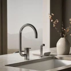 Single-handle kitchen sink faucet with two-function extended-reach spout and side sprayer