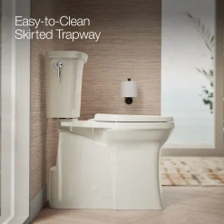 Tall two-piece elongated toilet with skirted trapway, 1.28 gpf