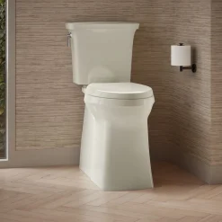 Tall two-piece elongated toilet with skirted trapway, 1.28 gpf