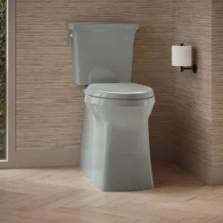 Tall two-piece elongated toilet with skirted trapway, 1.28 gpf