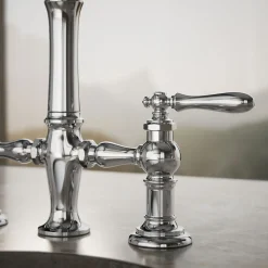 Three-hole bridge bar sink faucet with side sprayer