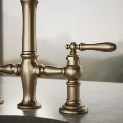 Three-hole bridge bar sink faucet with side sprayer