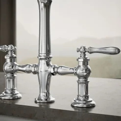 Three-hole bridge kitchen sink faucet with side sprayer