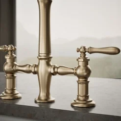 Three-hole bridge kitchen sink faucet with side sprayer