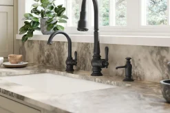 Touchless pull-down kitchen sink faucet with three-function sprayhead