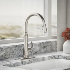 Touchless pull-down kitchen sink faucet with three-function sprayhead
