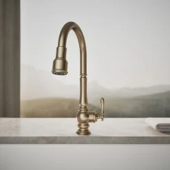 Touchless pull-down kitchen sink faucet with three-function sprayhead