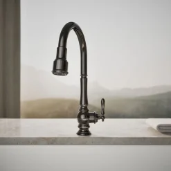 Touchless pull-down kitchen sink faucet with three-function sprayhead