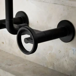 Two-hole wall-mount bridge kitchen sink faucet