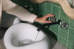 Wall-mount bathroom sink faucet handle trim
