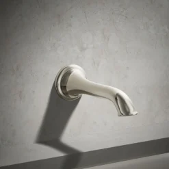 Wall-mount bath spout with flare design