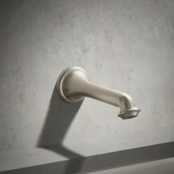 Wall-mount bath spout with turned design