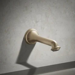Wall-mount bath spout with turned design